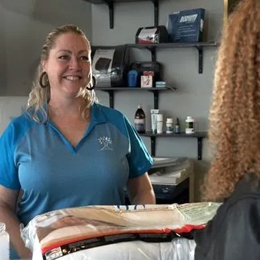 Megan Strohm, patient coordinator at Eagle Creek Chiropractic, at the front desk.